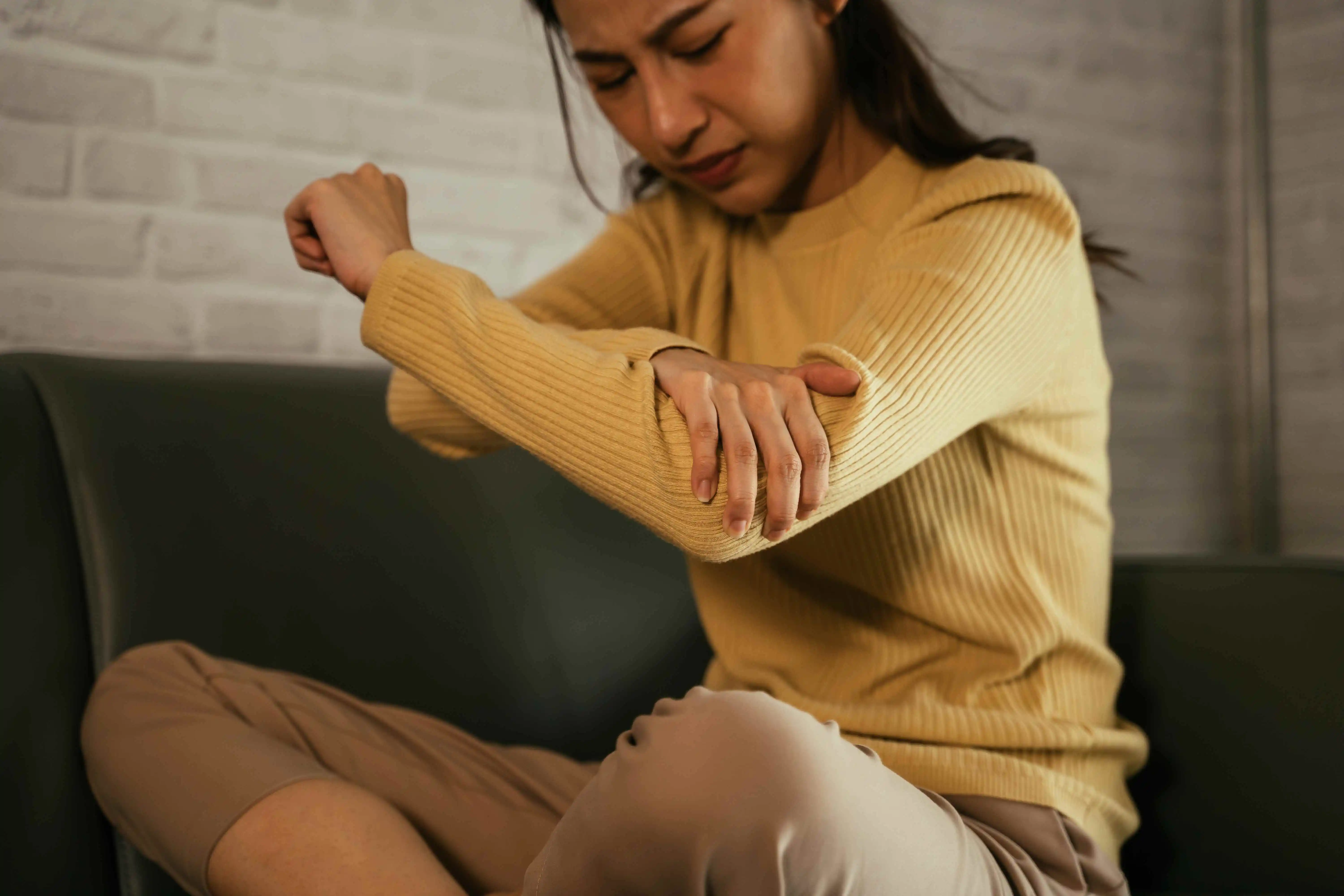 female suffering from elbow pain